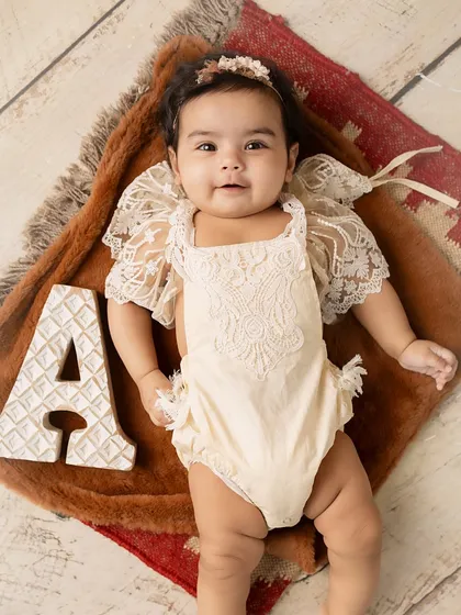 A happy, smiling portrait of the 5-month-old.