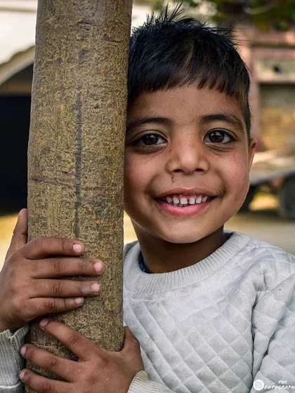 This is one of my favorite shots. The pure, unguarded joy in this boy's smile is what I'm always searching for in my street photography. It's these simple, happy moments that make the best pictures.