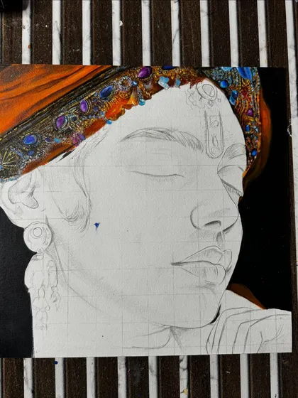 An in-progress shot of the cosmic Krishna painting. The grid lines are still visible as I begin to paint the jeweled turban.