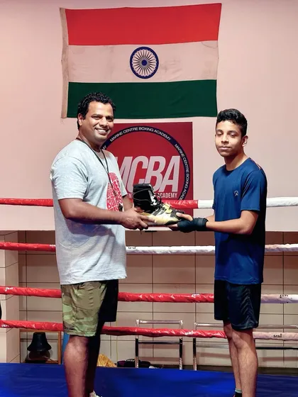 Rewarding another one of our top-performing boys with new boxing shoes to support his journey.