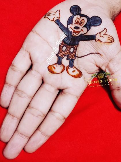 I also do fun designs for the youngest members of the celebration. This simple palm design features a perfect rendition of Mickey Mouse, bringing a smile to any child's face.