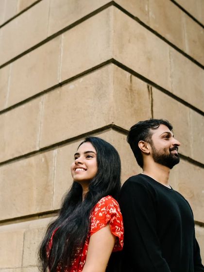 A simple, happy moment captured in the warm afternoon light. This candid shot shows their bright smiles and easy connection, which is the essence of my couple photography.
