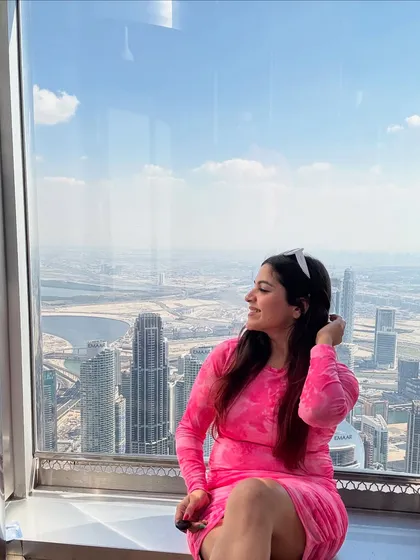 Another shot from the top of the Burj Khalifa. The bright pink of my dress stood out beautifully against the blue sky and the cityscape.