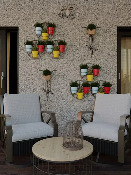 This balcony design brings a rustic, countryside charm to an urban apartment. The combination of comfortable seating, decorative wall planters, and a wine barrel table creates a cozy and inviting atmosphere.