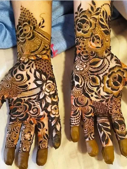 A stunning example of how different patterns can work together on two hands to create a beautiful and unique bridal look.