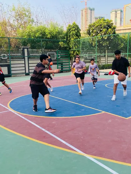 Players run a drill, focusing on passing and movement.