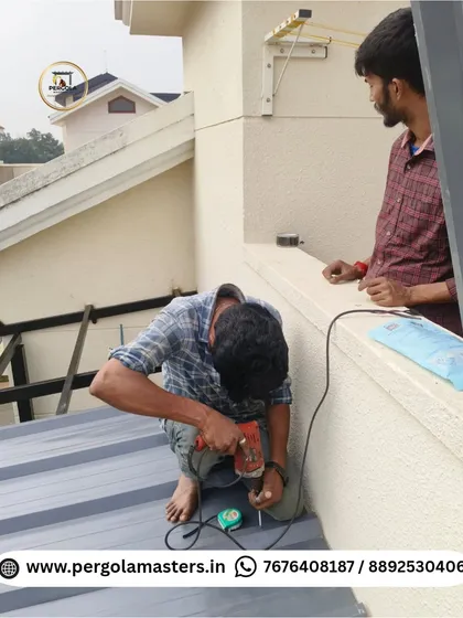 Our team at work installing a puff sheet roof. Safety and precision are paramount as we drill and fasten the panels, ensuring a secure and durable extension for this villa.