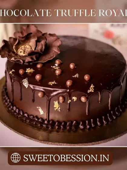 Our Chocolate Truffle Royale cake, featuring a glossy chocolate glaze, gold leaf, and a beautiful chocolate flower.