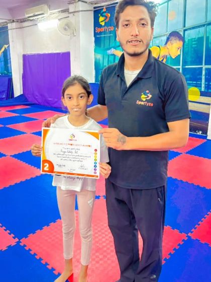 This gymnast has earned her Level 2 certificate, a significant milestone in our competitive gymnastics program.