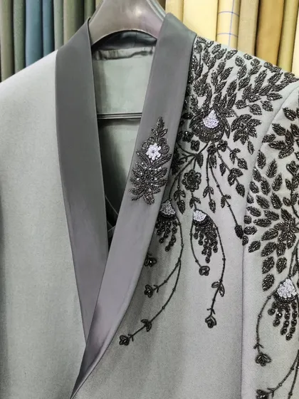 A collection of our designer suits, showcasing a variety of colors, fabrics, and custom details like embroidery, unique lapels, and accessories. Each piece is crafted to make a lasting impression.