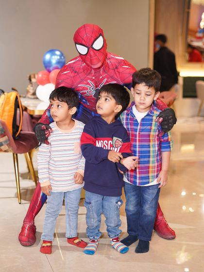 A group of young heroes poses with Spider-Man. Our character appearances are a highlight of any party, providing amazing photo opportunities and lasting memories.