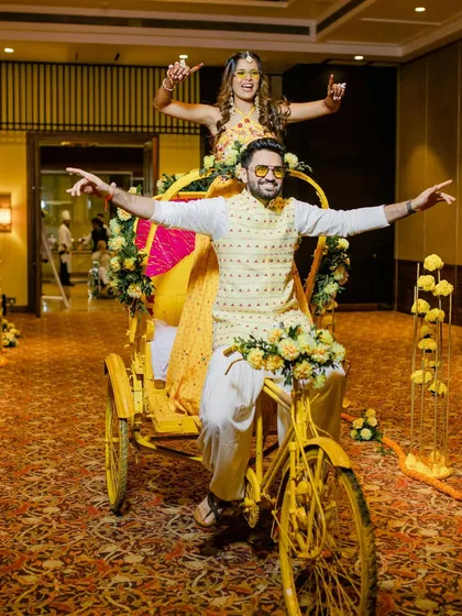 A quirky and fun Haldi entry on a decorated cycle rickshaw. We love creating unique entry concepts that reflect the couple's personality and the event's theme.