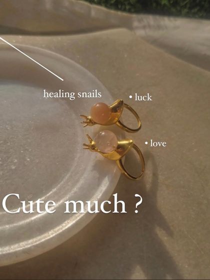 My 'snáil' rings are a whimsical way to carry healing energy. This image shows the Rose Quartz snail for love and the Peach Moonstone snail for luck.