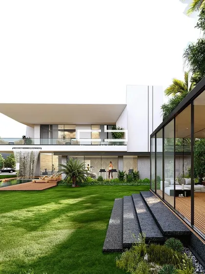 This modern residential design embodies a contemporary aesthetic with a striking cantilevered projection and minimalist form. A cascading waterfall is integrated into the structure, showcasing innovative design while enhancing the microclimate of the residence.
