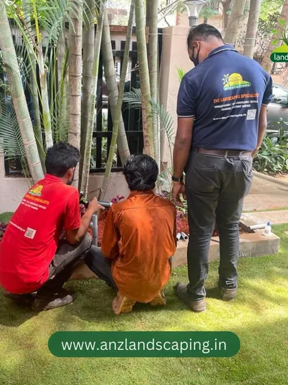 A supervisor oversees the planting of bamboo shoots, a popular choice for creating natural privacy screens in residential gardens.