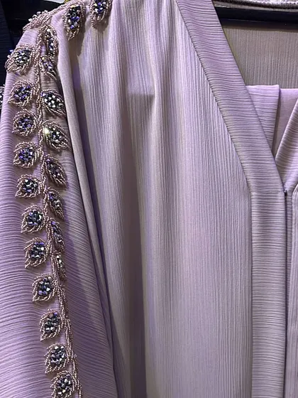 The detail on this lilac abaya is just stunning. The intricate leaf pattern with beaded details along the sleeve is a perfect example of the unique, high quality 'glam' pieces I find.
