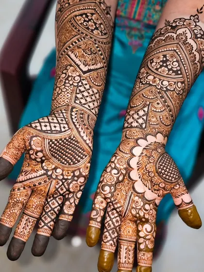The full view of this bridal design, showing how different patterns on each hand can create a stunning, cohesive look.