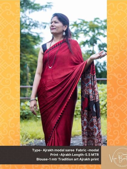 This photo captures the joy of wearing a beautiful saree. Our customer is glowing in a red Ajrakh modal saree, the perfect choice for adding a touch of traditional elegance to your day.
