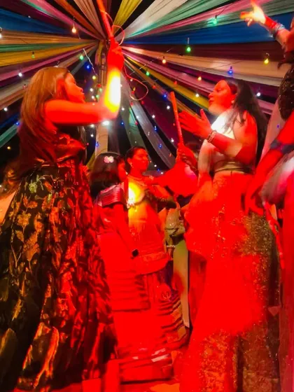 Another action shot from the Dandiya dance floor. The red lighting added to the high-energy feel of the night.