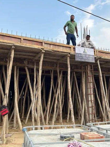 A proud moment on-site as the design starts taking physical shape. This image shows the shuttering and formwork for a roof slab, with our team overseeing the process to ensure structural integrity.