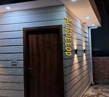 A collection of images from a rooftop study room project in Rohini. The photos show the stylish exterior at night, the clean and simple interior, and the quality of the finishing touches.