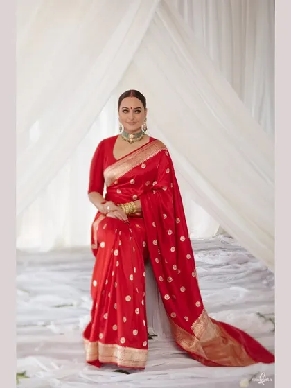 A beautiful portrait of Sonakshi in her stunning red reception saree. We aim to capture not just the outfit, but the personality and grace of the person wearing it.