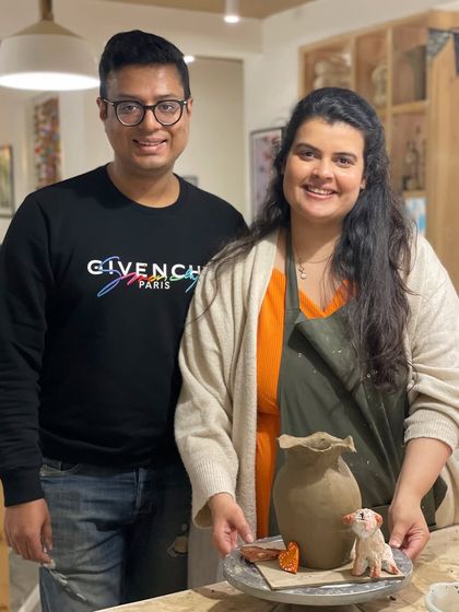 This couple celebrated an anniversary by creating a beautiful clay vase and sculpture together. It's a wonderful way to collaborate on a keepsake for your home.