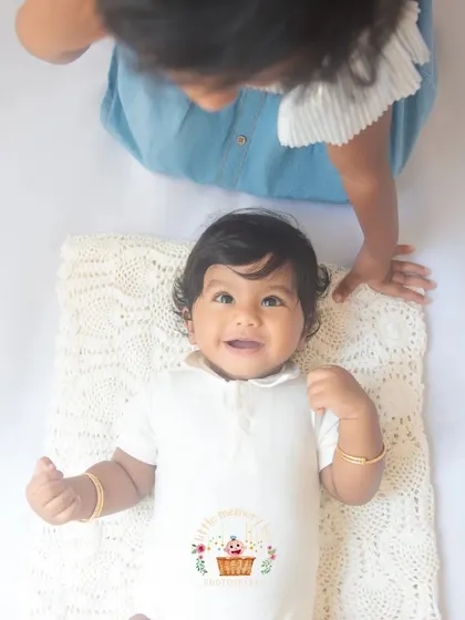 A duplicate of image 61, showing that sweet, gentle moment of a big sister admiring her new sibling. It's the beginning of a lifelong friendship.