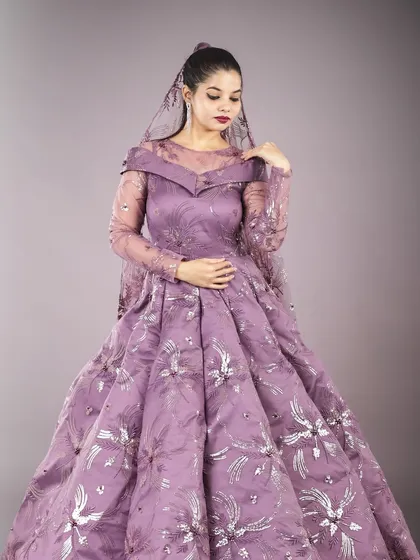 A beautiful shot from a collaboration, featuring a stunning lavender gown with silver floral embroidery and a matching sheer dupatta.