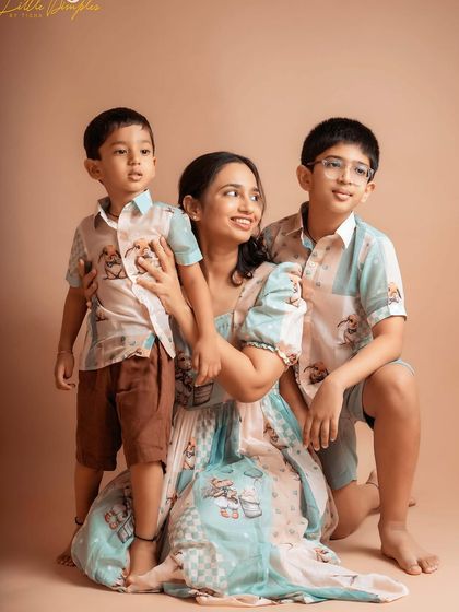 A beautiful portrait of a mother with her two boys, showing their close bond and happy energy.