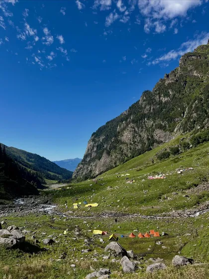 A view of the vast, open valley on the Hampta Pass trail, with our campsite looking like a tiny settlement in the grand scheme of the Himalayas.