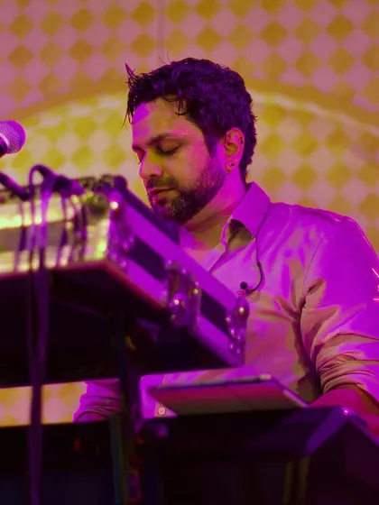 A close-up of Johaan focused on the keyboard during a live wedding set. Every note is played with intention to keep the party going.