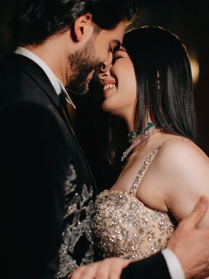 Laughter and love captured in a close-up. This candid moment shows the genuine happiness and affection between the couple, a perfect example of the real emotions we strive to capture during engagement celebrations.