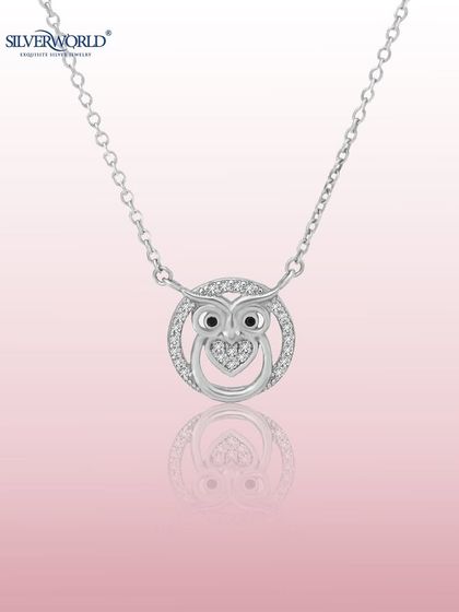 A symbol of midnight wisdom, this Owl Necklace is artfully crafted in 925 silver. The design features a circular frame studded with Zirconia, with a wise owl and a heart at its center.