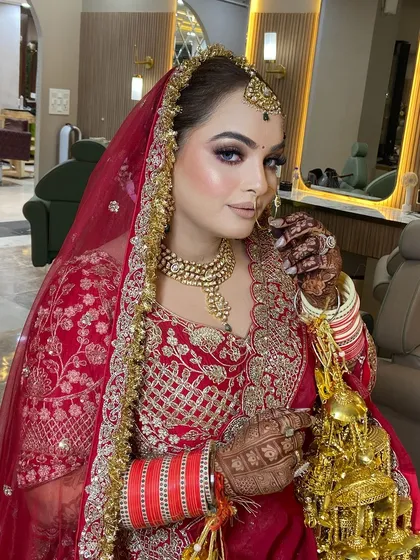 Another angle of this gorgeous bride. The makeup is bold yet elegant, perfect for a bride who wants to make a statement.