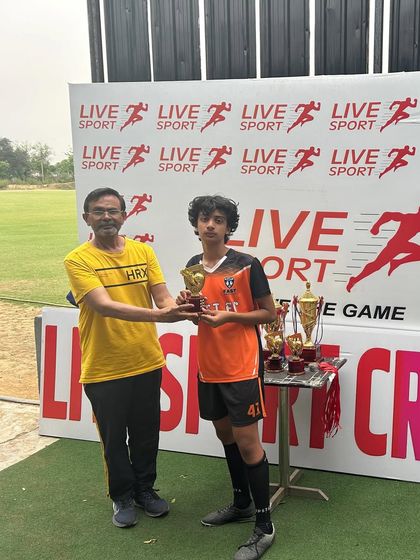 Recognizing individual excellence, one of our U11 players receives his trophy at the Junior Football League.