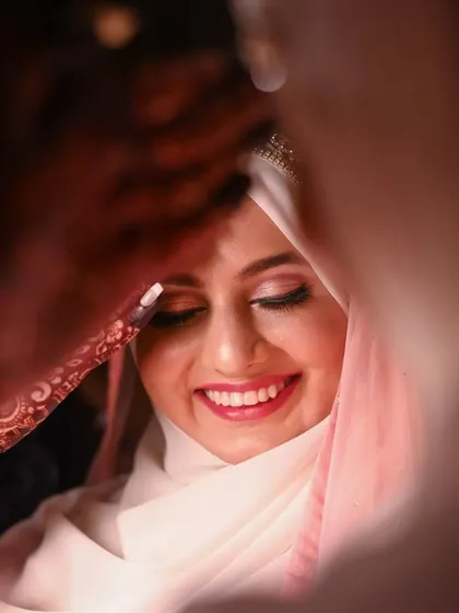 A beautiful close-up of the bride-to-be, her smile lighting up the frame. This intimate portrait captures the excitement and emotion of her engagement day.