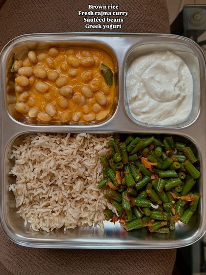 A simple, repeated meal of brown rice, fresh rajma curry, sautéed beans, and Greek yogurt. Repetition is normal in a busy week, and it's better to eat a healthy meal you enjoy than to struggle for constant variety.