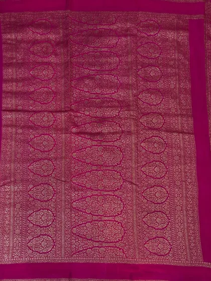 The pallu of the royal blue Bentex Banaras saree, showcasing the intricate weaving.