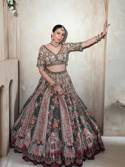 A full-length shot of the floral lehenga, showing its grand silhouette. This is a perfect rental piece for making a statement at any wedding event.