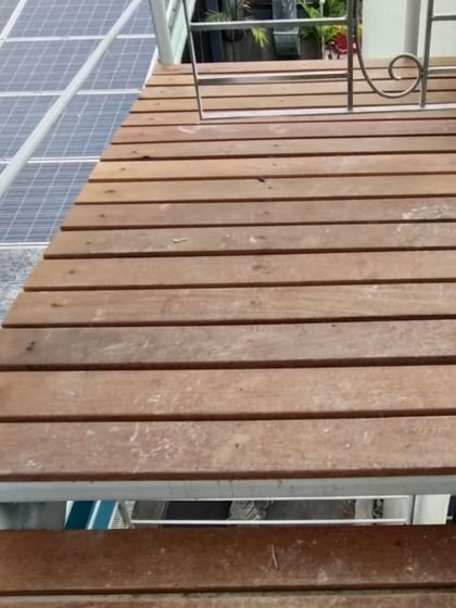 We also build functional elements like these sturdy wooden steps, providing access over a sloped roof with solar panels.
