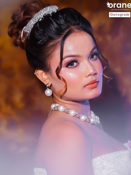 A beautiful portrait of a student's portfolio work, featuring a classic Christian bridal look. The soft makeup and elegant updo are key skills I teach for this style.