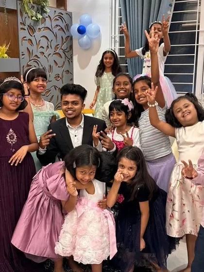The best way to end a show is with a big group photo filled with happy, smiling faces. This is the result of a fun-filled magic performance at a private birthday party, creating a memory the kids will cherish.