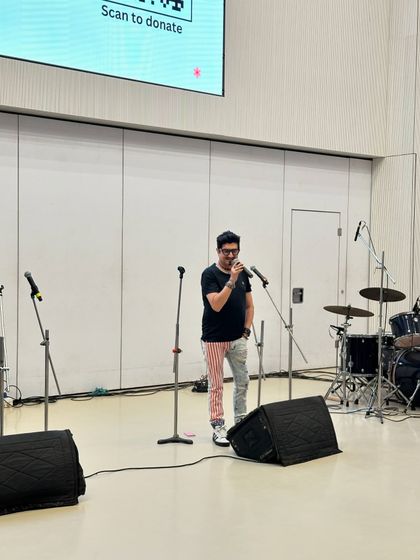 Musician Neeraj Shridhar speaking at our fundraiser event.