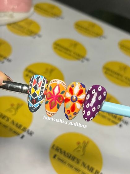 Get ready for garba with these Navratri-themed nails. I hand-painted these with vibrant, intricate patterns inspired by traditional chaniya choli designs to make sure your nails are as festive as your outfit.