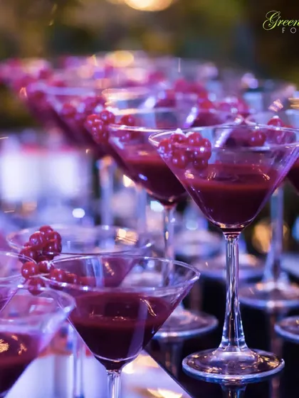 Adding a touch of style and luxury to the beverage service. These elegant martini glasses are filled with a deep red Cranberry Sorbet, a sophisticated and refreshing treat for guests to enjoy.