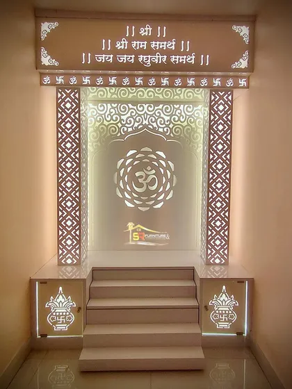 This is one of our custom-built mandir designs, creating a peaceful and divine corner in the home. We used backlit panels with intricate jaali patterns and the Om symbol to create a warm, spiritual glow. The design includes steps and a raised platform, all crafted from high-quality Korian material.