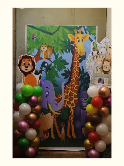 A fun photo-op area with a backdrop full of friendly jungle animals, perfect for kids to enjoy.