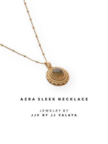 The Azra Sleek Necklace is a perfect example of minimal elegance. This product shot highlights its delicate chain and the intricate pendant, a piece you can wear every day.