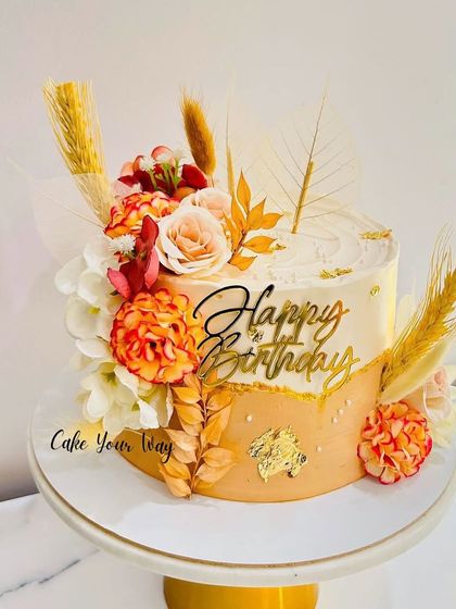 Blooming with sweetness and charm. A unique floral cake with warm, earthy tones.